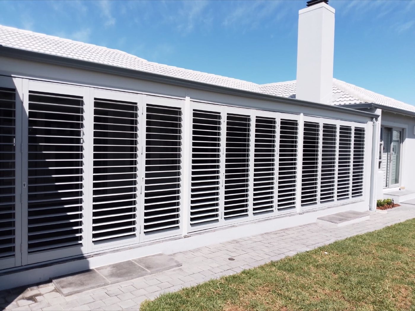 Patio enclosed with lockable aluminium security shutters