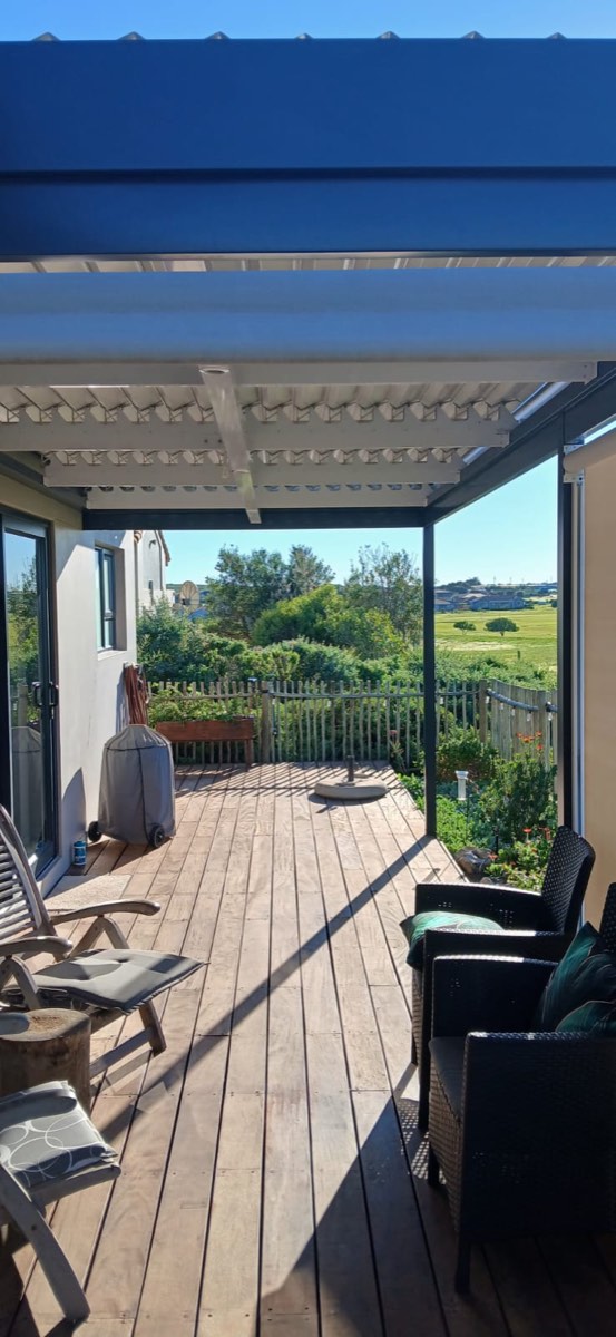 Corner outdoor roller blinds combined with a louvre awning on a Tokai patio