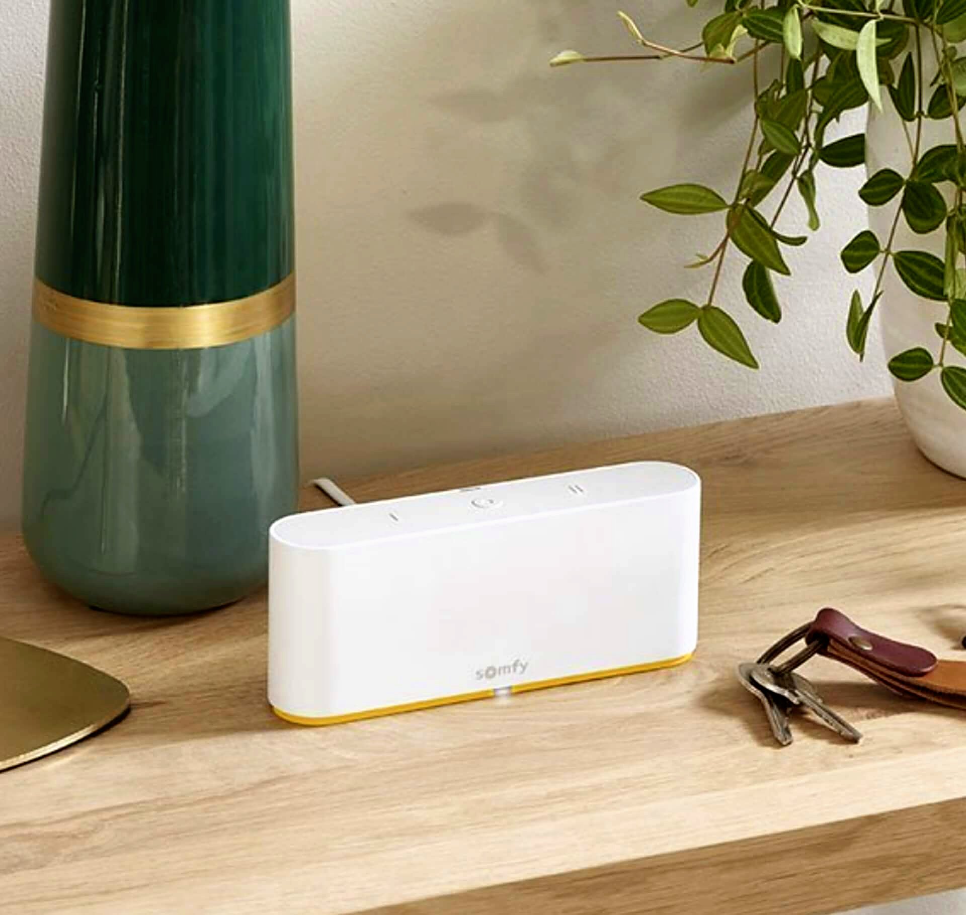 Somfy smart-home hub on a wooden hall table
