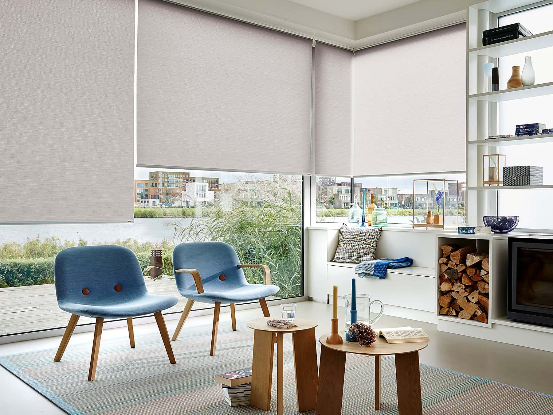 Blush pink roller blinds in an elegantly styled lounge