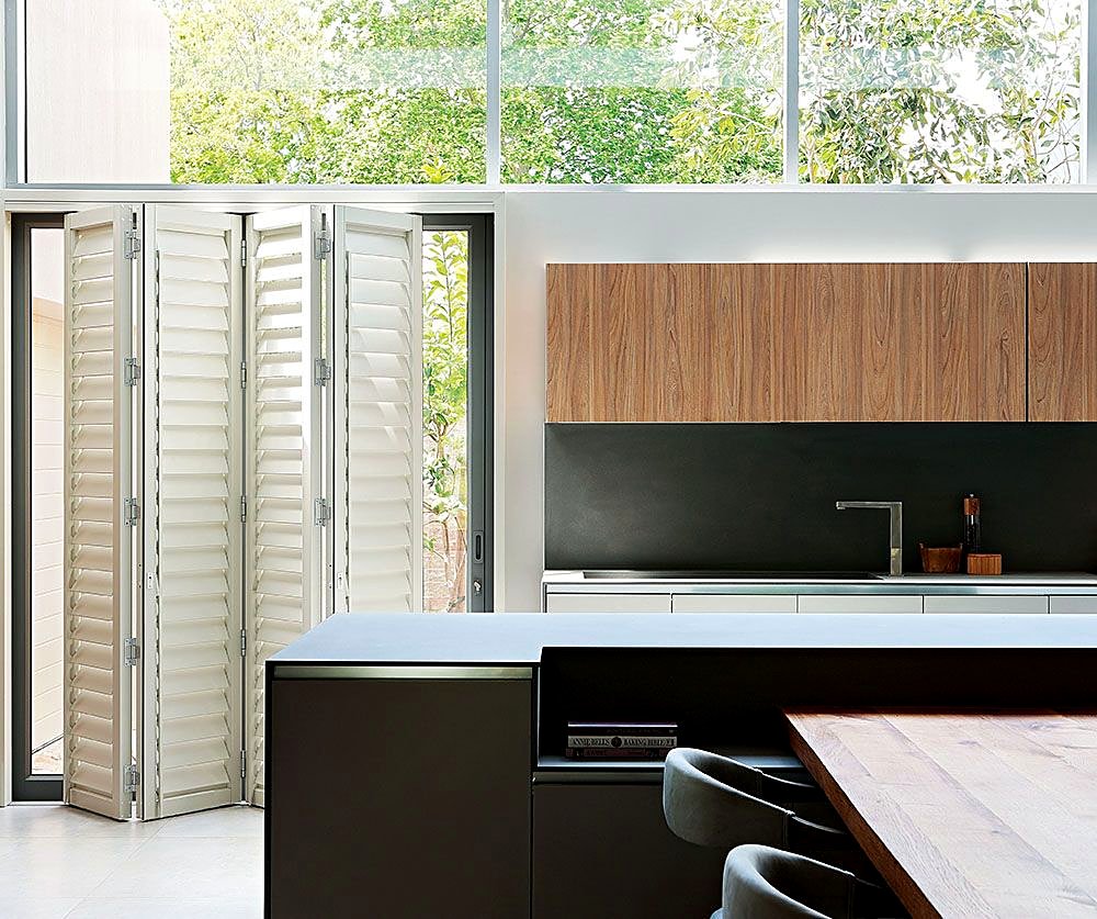 White bi-fold shutters in a modern kitchen