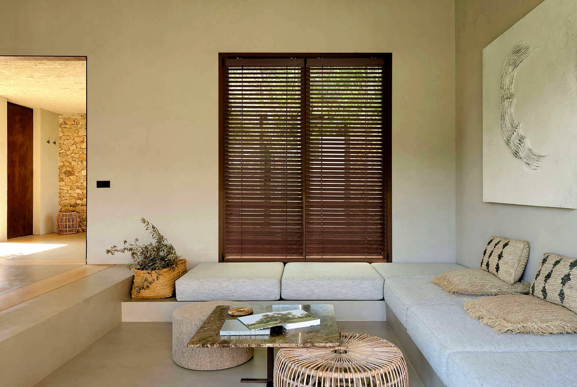 Dark bamboo venetian blinds in a serene modern lounge